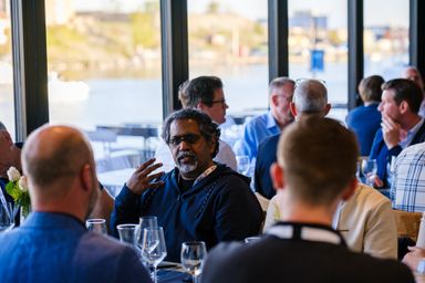 Aslam Khan engaged in group discussions at dinner